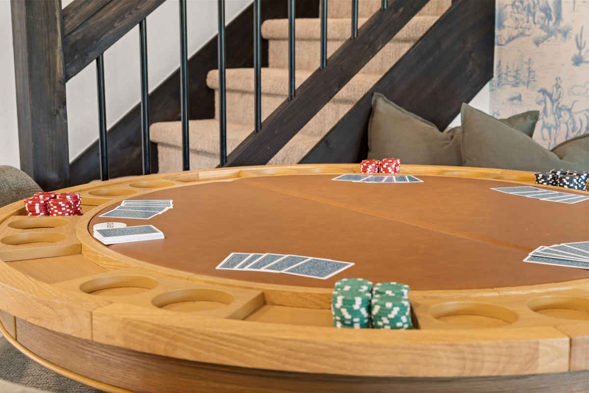 Ante up at the felt-topped poker table, chips stacked and cards dealt in the great-room game area.