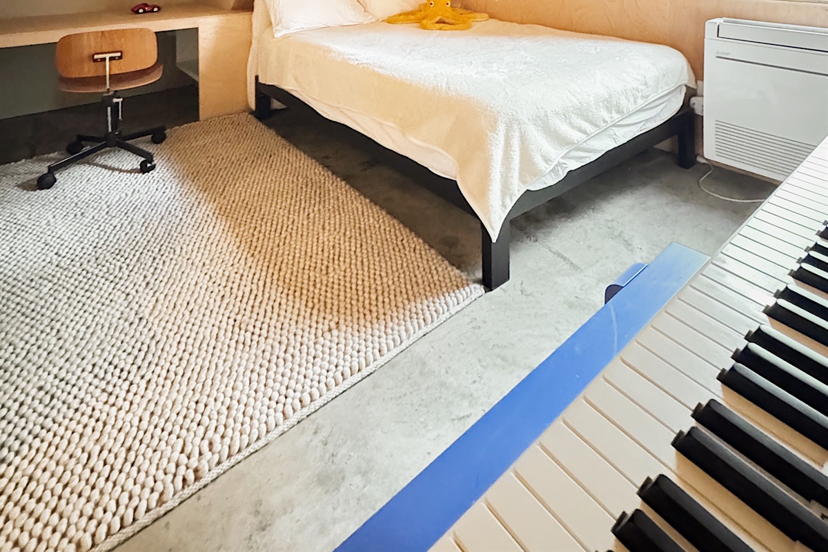 Digital Piano in downstairs bedroom.