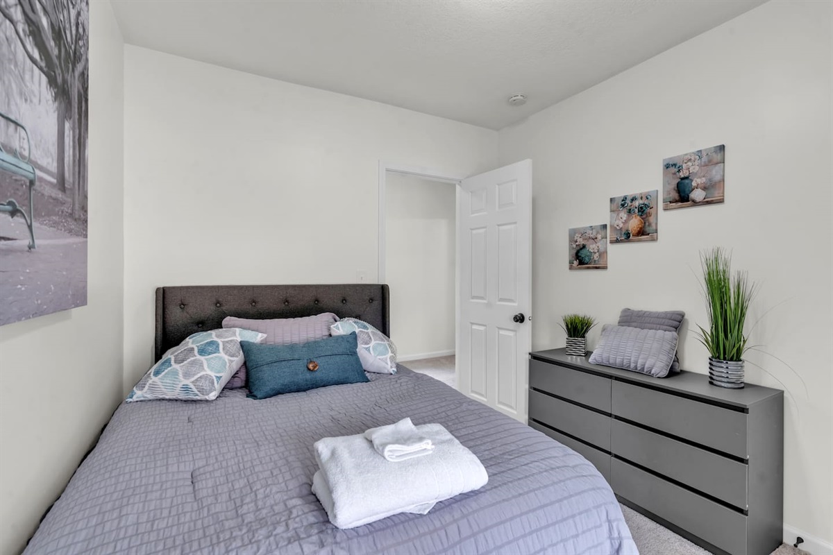 Comfortable bedroom with a spacious cabinet, offering plenty of storage for your belongings during your stay.