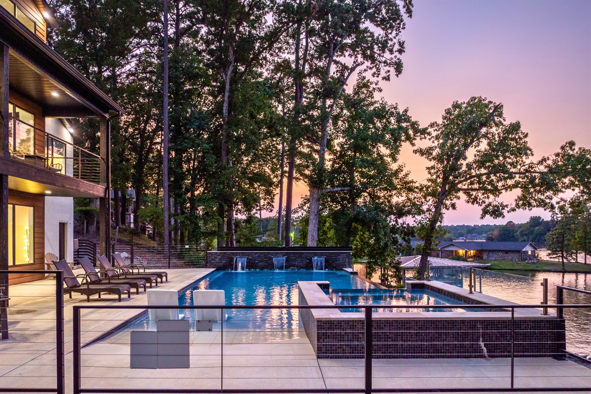 Firefly glows at dusk with shimmering pools and serene forest surroundings.