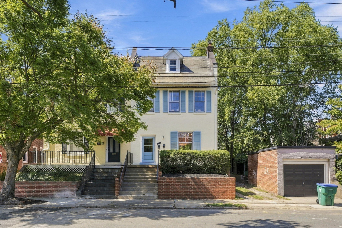 Charming Exterior: Step into comfort with lovely landscaping and vibrant historic charm!