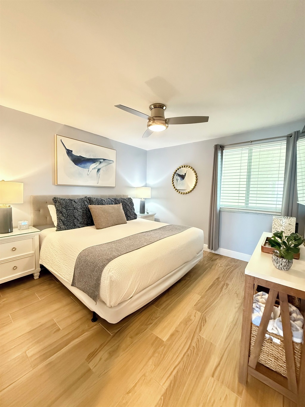 King bed and a 55” flat screen Smart TV mounted on wall