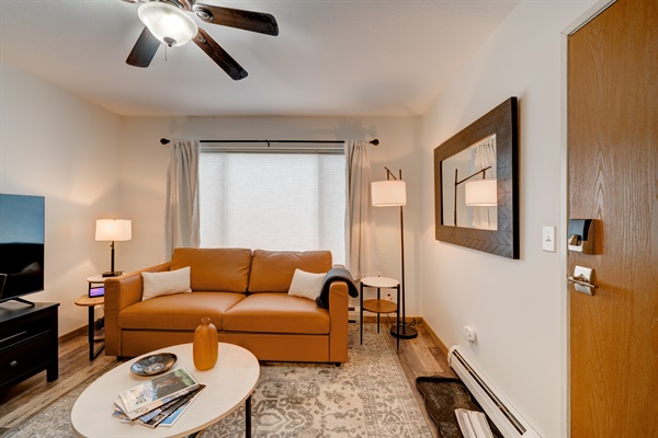 Enter into a spacious and warm living room where there's a beautiful leather sofa, and an elegant coffee table!