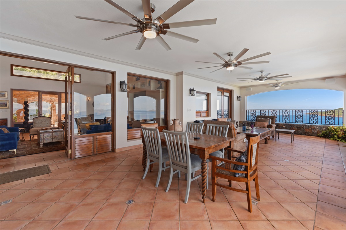 You will find two 6-seater dining tables and a conversation area.