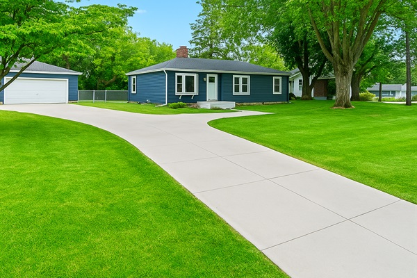 Spacious corner lot with a long driveway, mature trees, and a peaceful neighborhood vibe—just minutes from the lake.