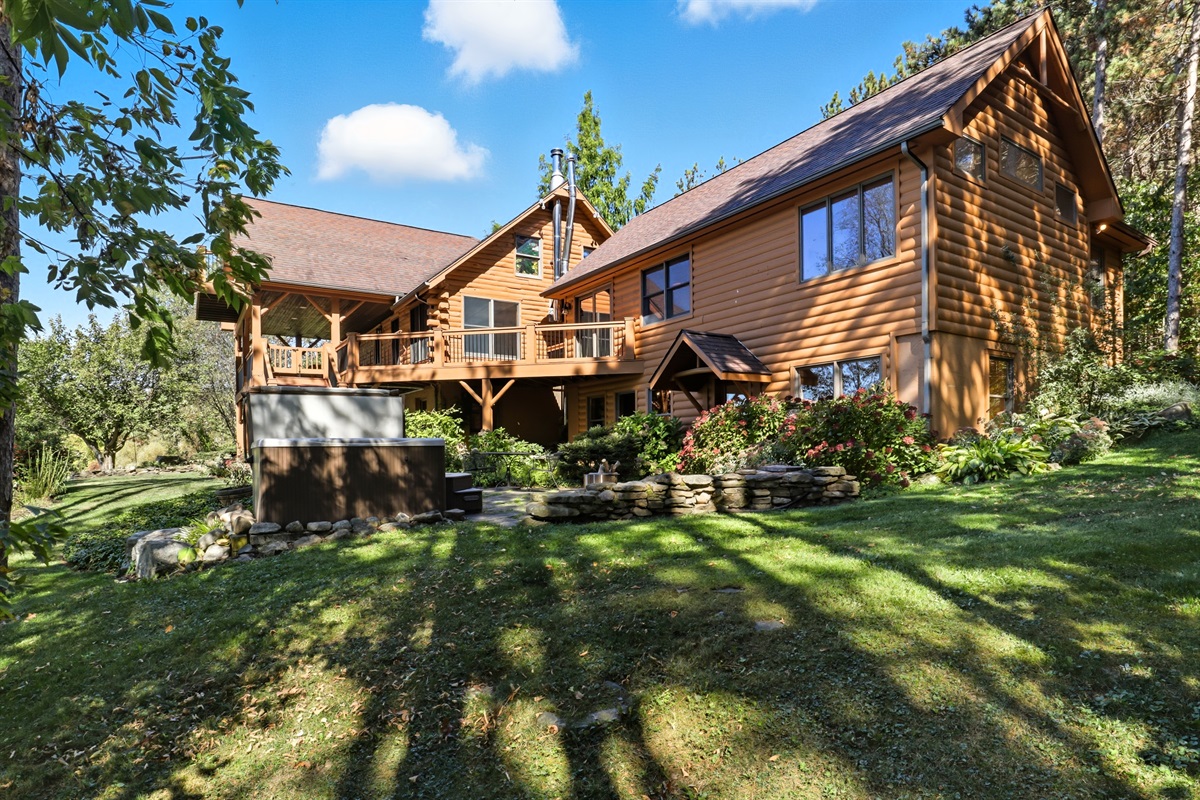 Wide front yard with a welcoming home view.