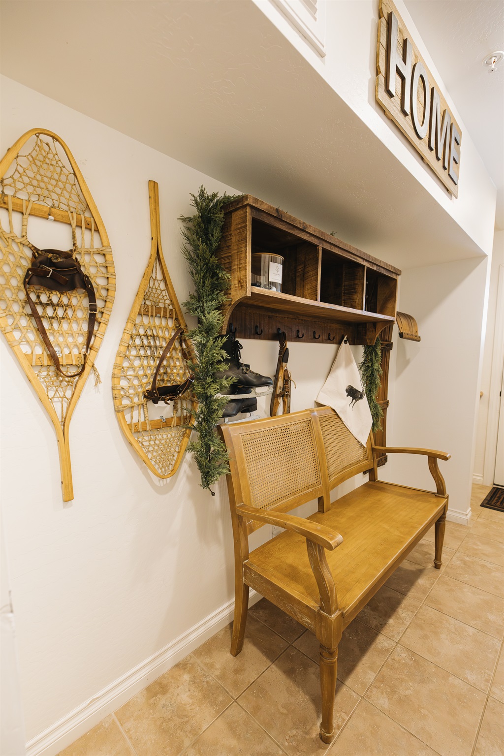 Welcoming entry with bench and storage for coats, boots, and ski gear. Designed for comfort and convenience, this cozy Pinetop condo is ideal for couples and families enjoying the White Mountains.