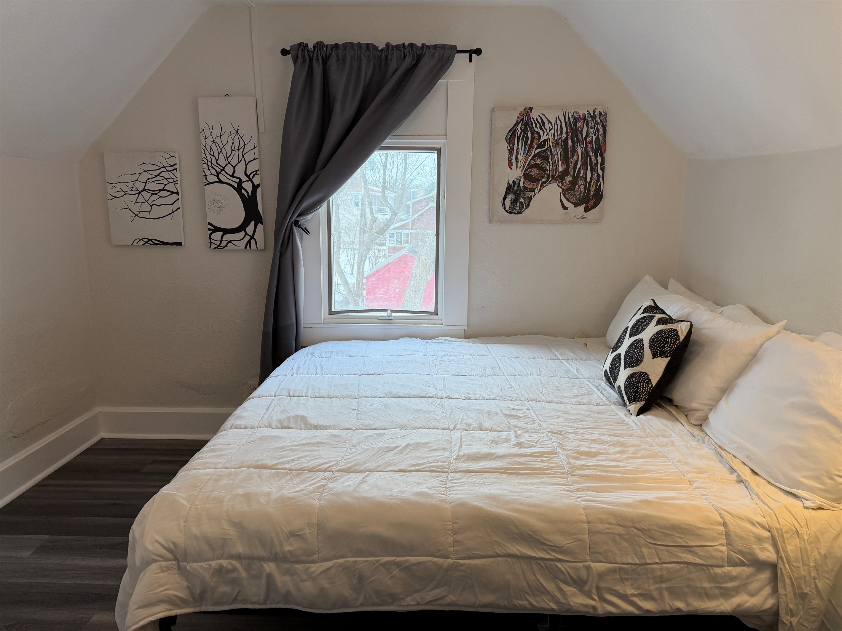 The upstairs king bedroom overlooks the backyard.