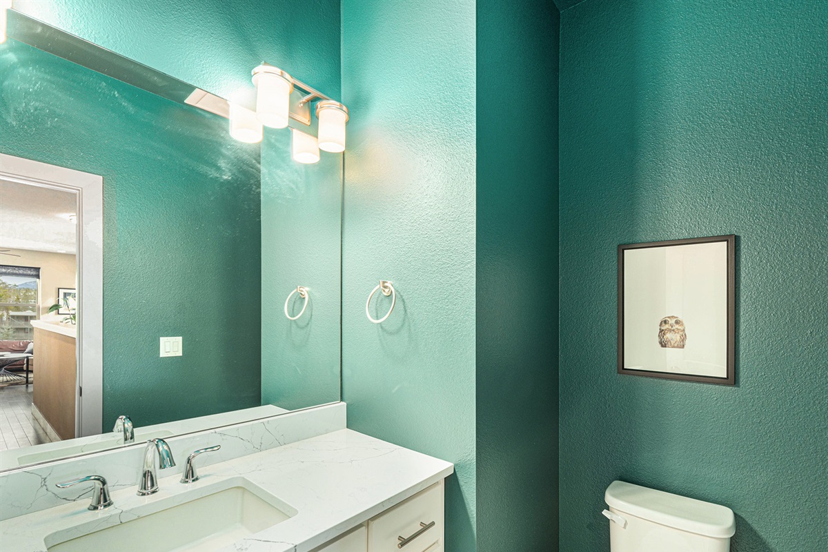 A half bath is just off the kitchen on the upper level