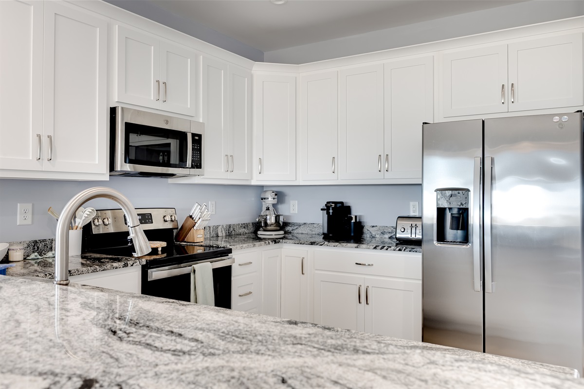 Fully equipped kitchen with ample counter space for cooking and prepping meals