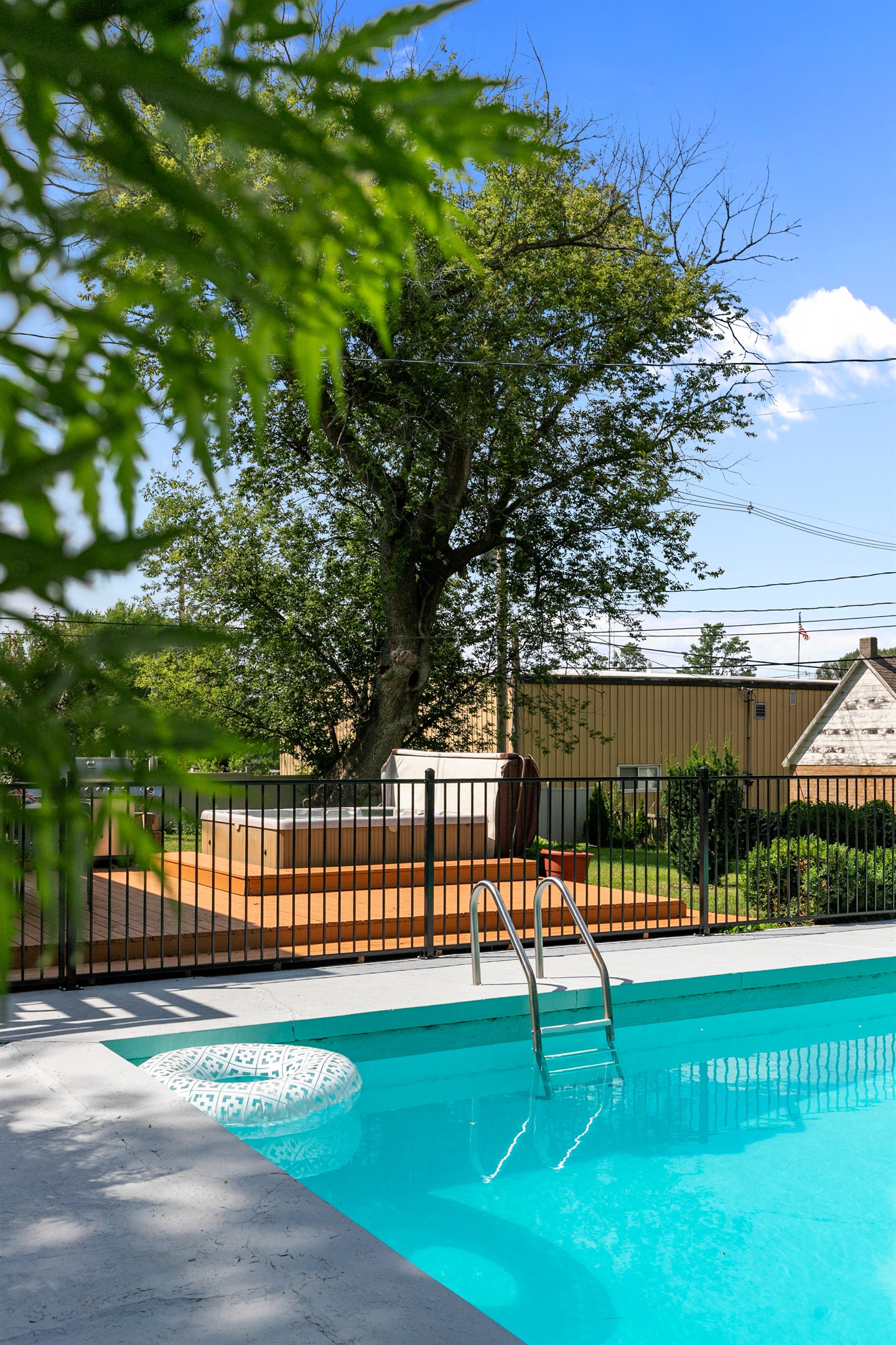 Cool off on warm days by jumping into the sparkling in-ground pool — the perfect spot for both fun and relaxation.
