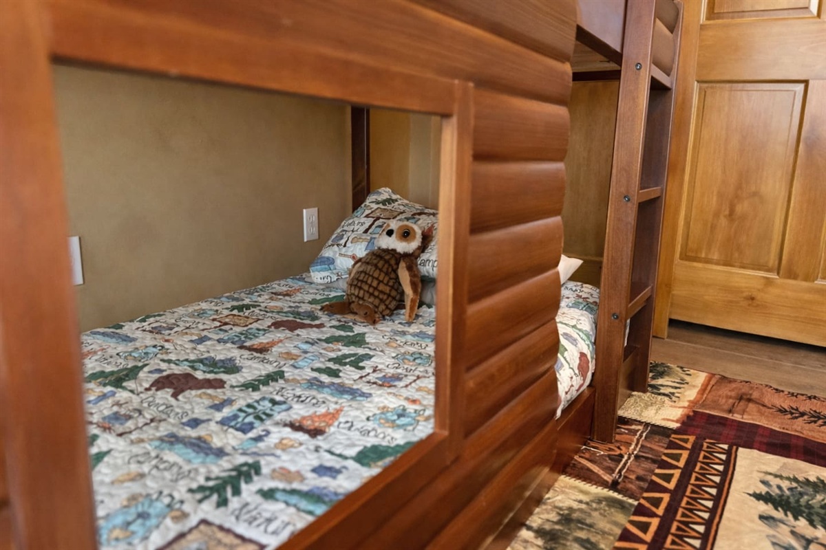 Log-style bunk room with two individual twin beds — kids love it.