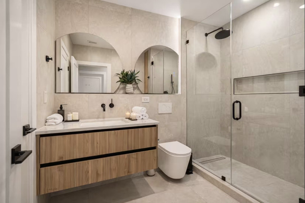 Designer bathroom with spacious walk-in shower and double vanity