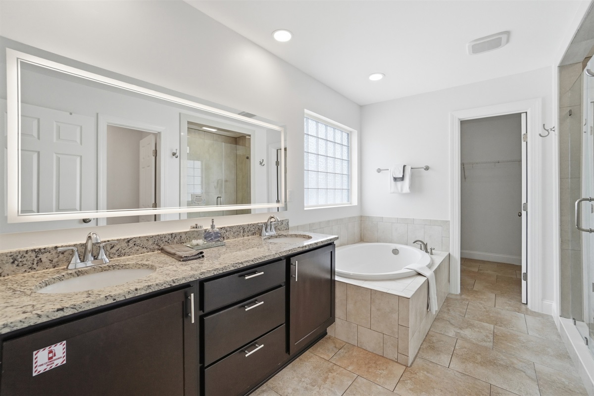 Huge master bathroom with stand alone bathtub