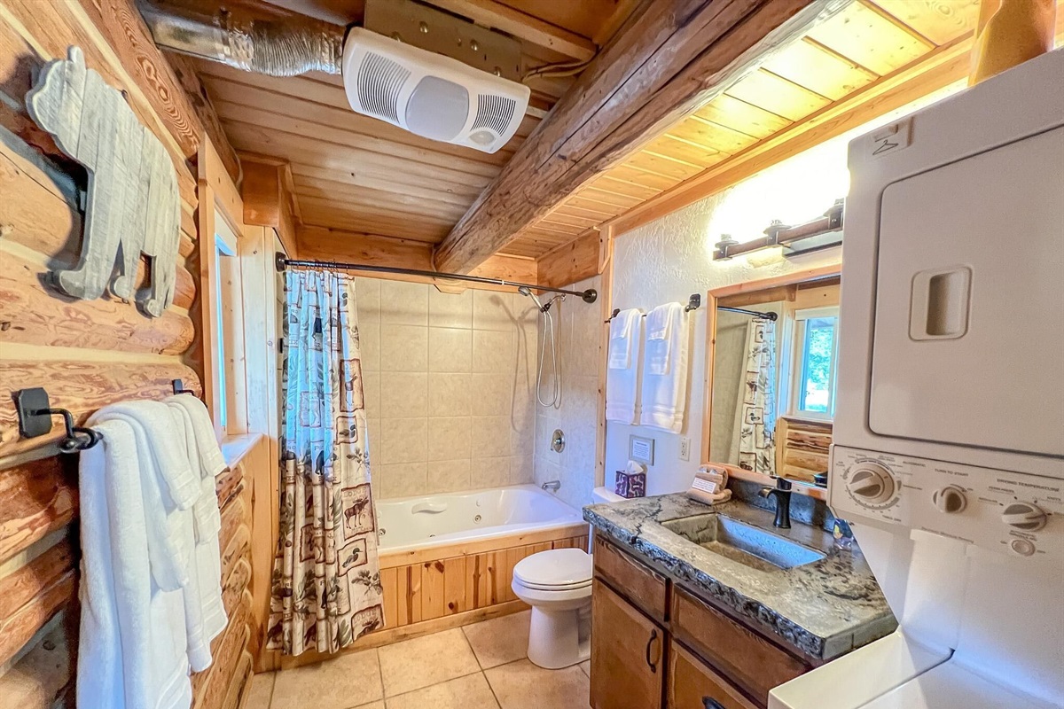 Bathroom with Jacuzzi Tub and washer dryer