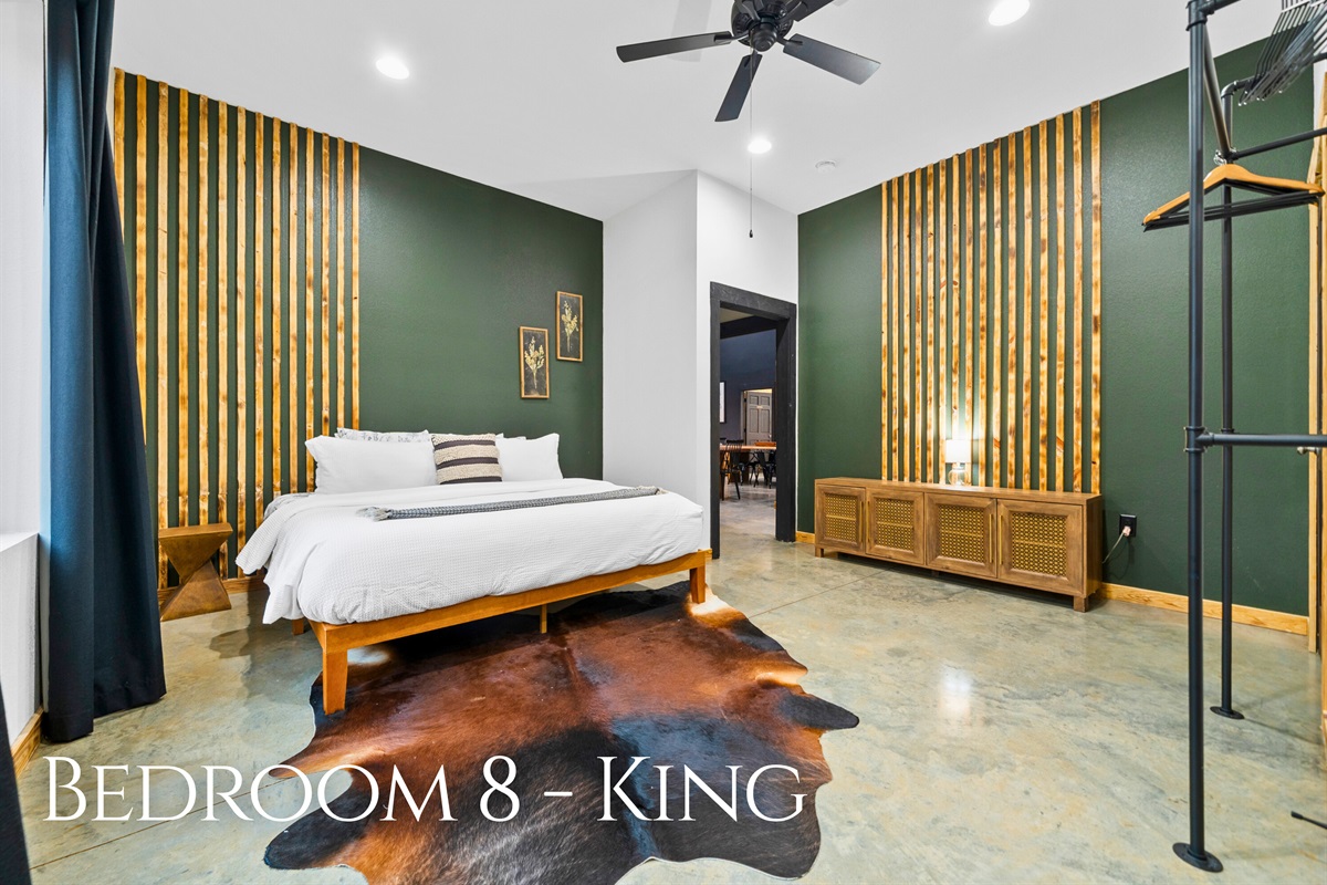 Bedroom 8 continues the lineup of king accommodations, featuring soft lighting and inviting textures for a restful stay.