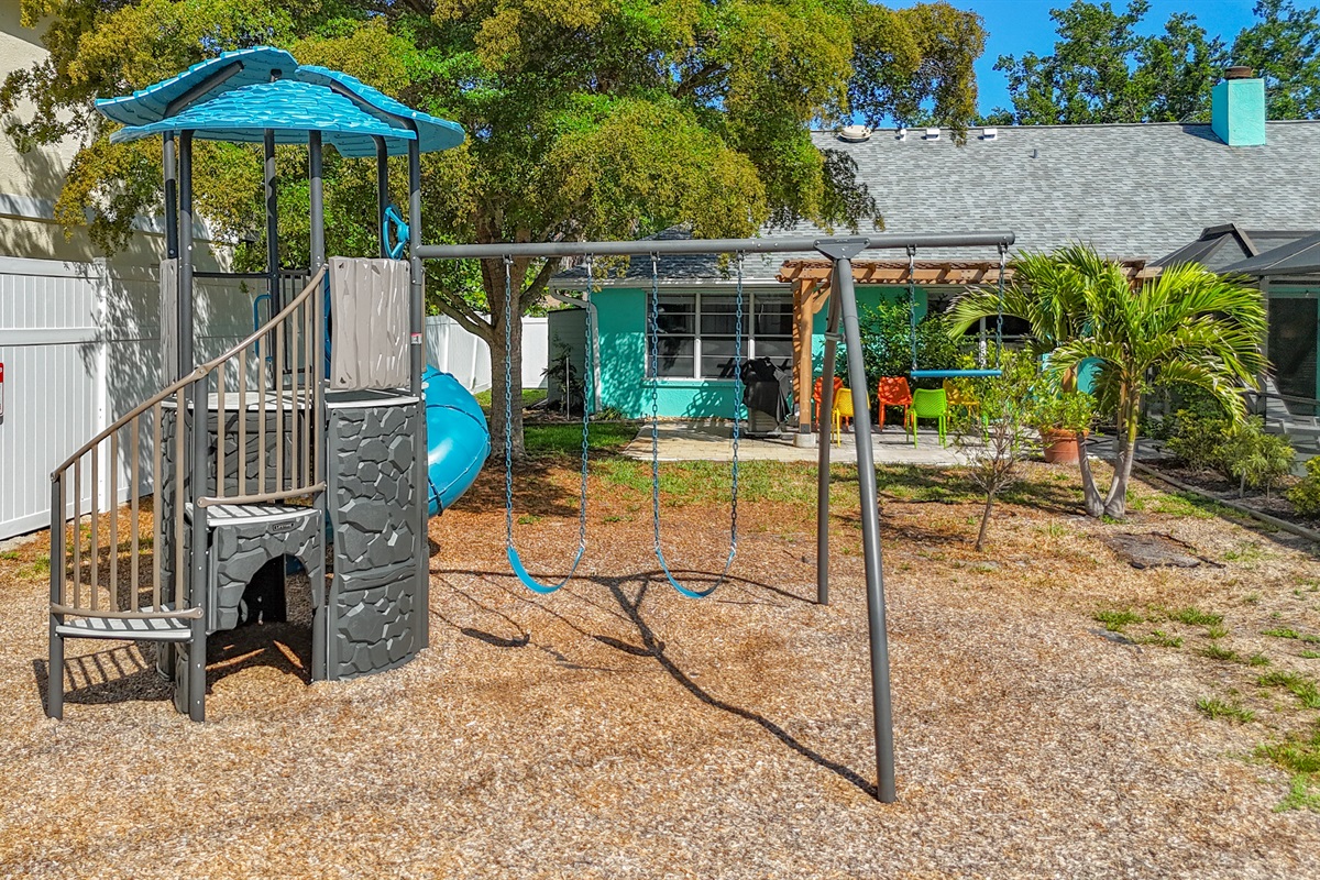 Our tranquil private backyard, with an outdoor playset - perfect for your little ones!