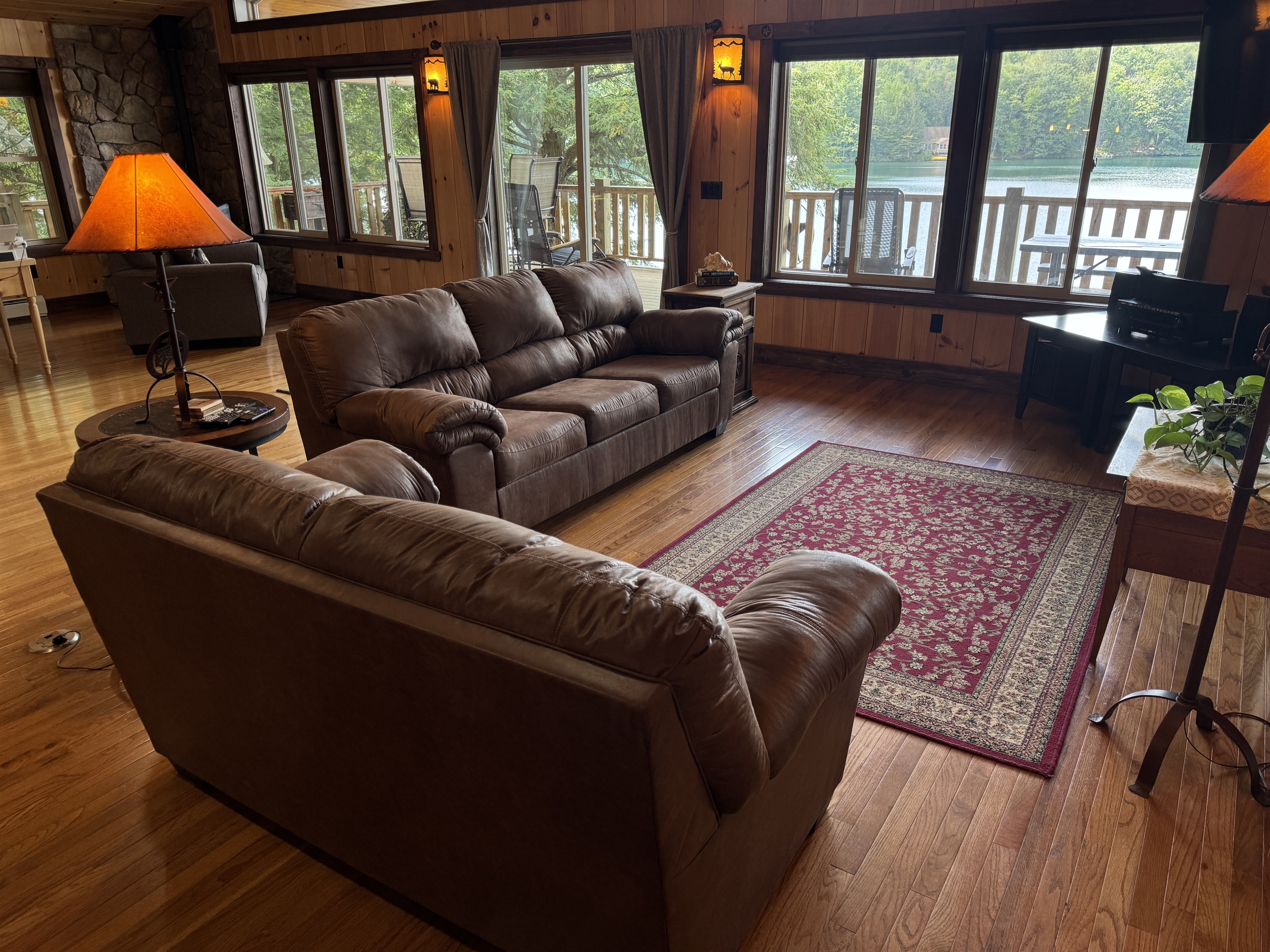 Living area with large windows facing the water