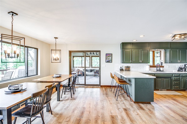 Kitchen island with bar seating and modern appliances