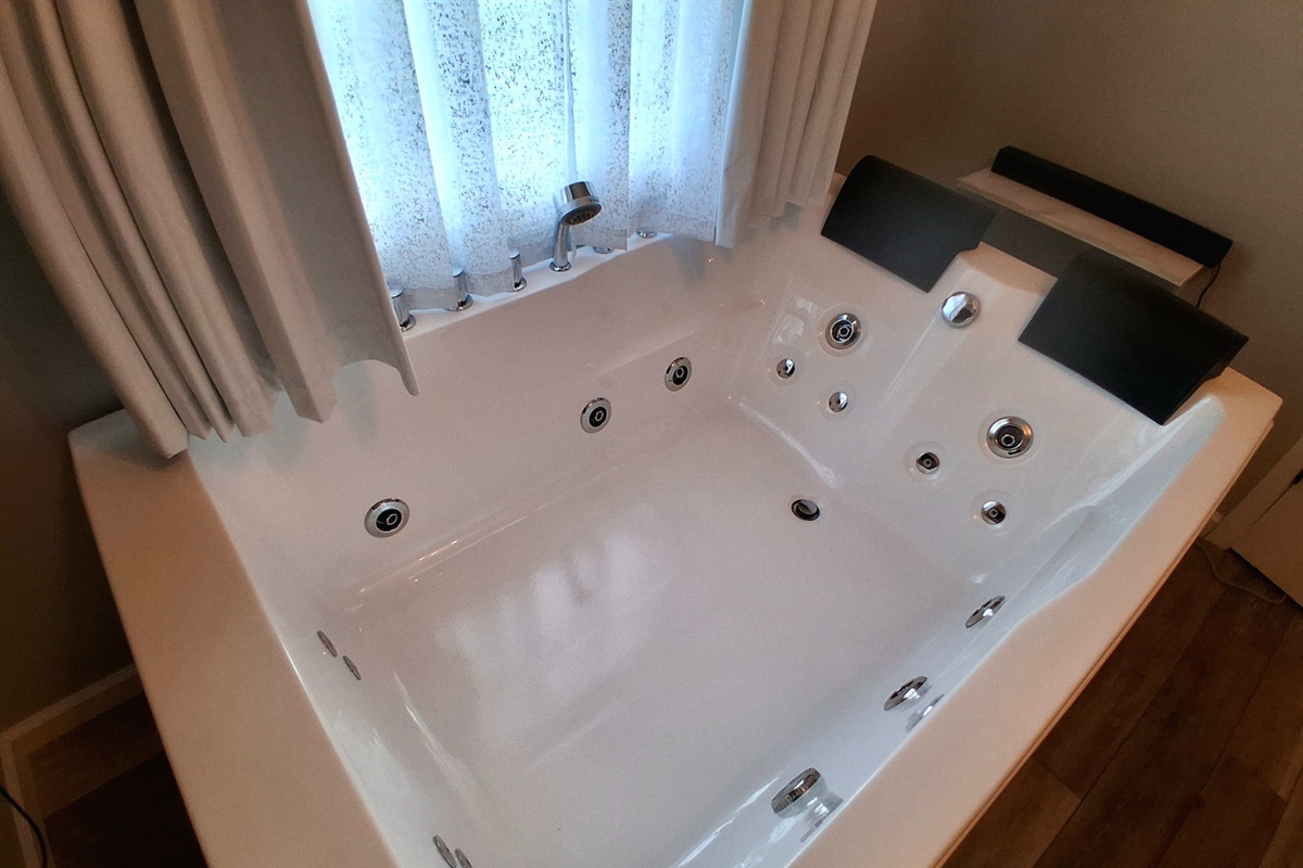 Luxe & Serene:  Enjoy the gentle bubbles of a heated jetted tub for two, designed for pure relaxation.