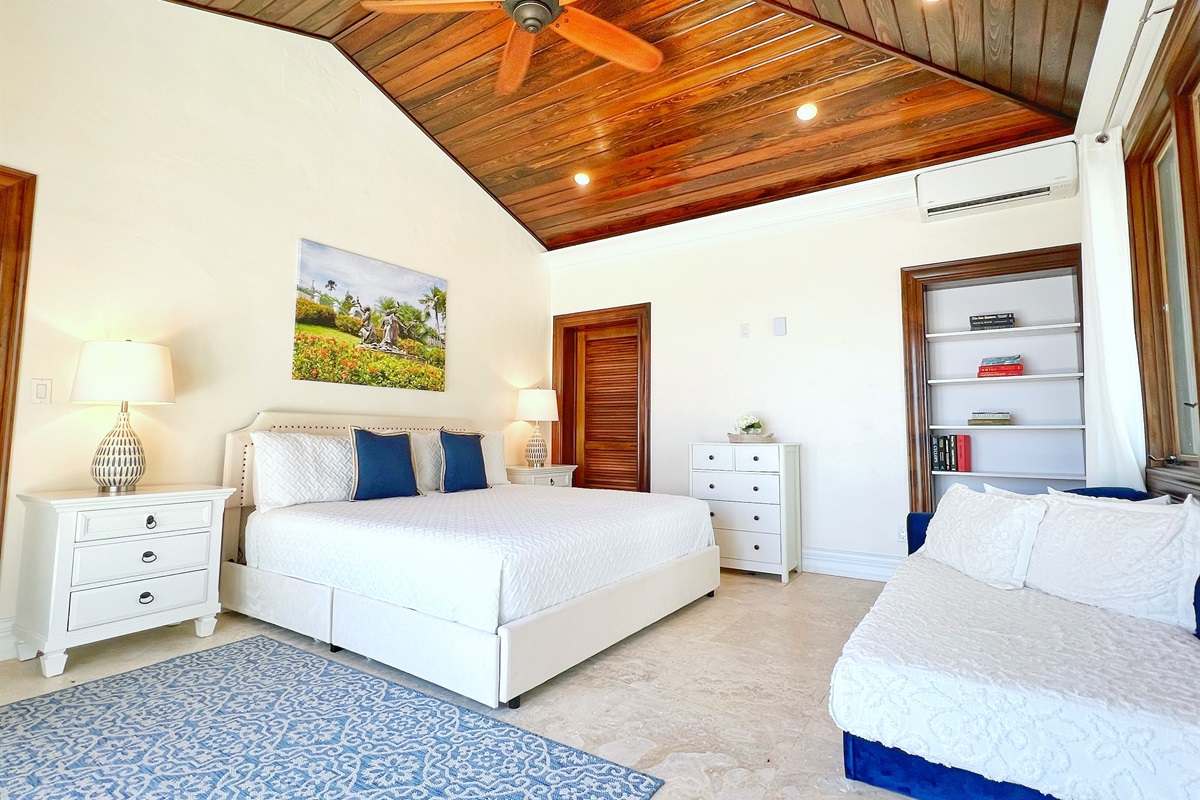 Sleep soundly in Bedroom 1 with plush bedding and soft lighting.