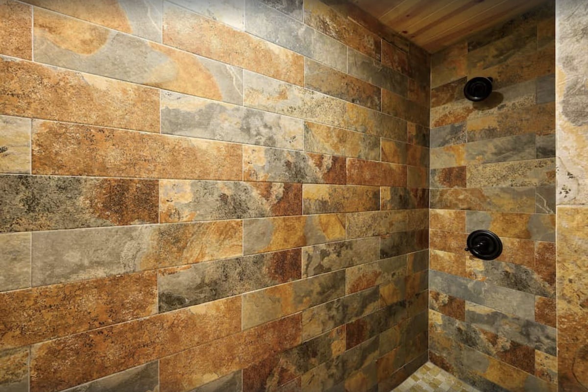 Luxurious Shower with Sleek Stone Walls-Bathroom 1