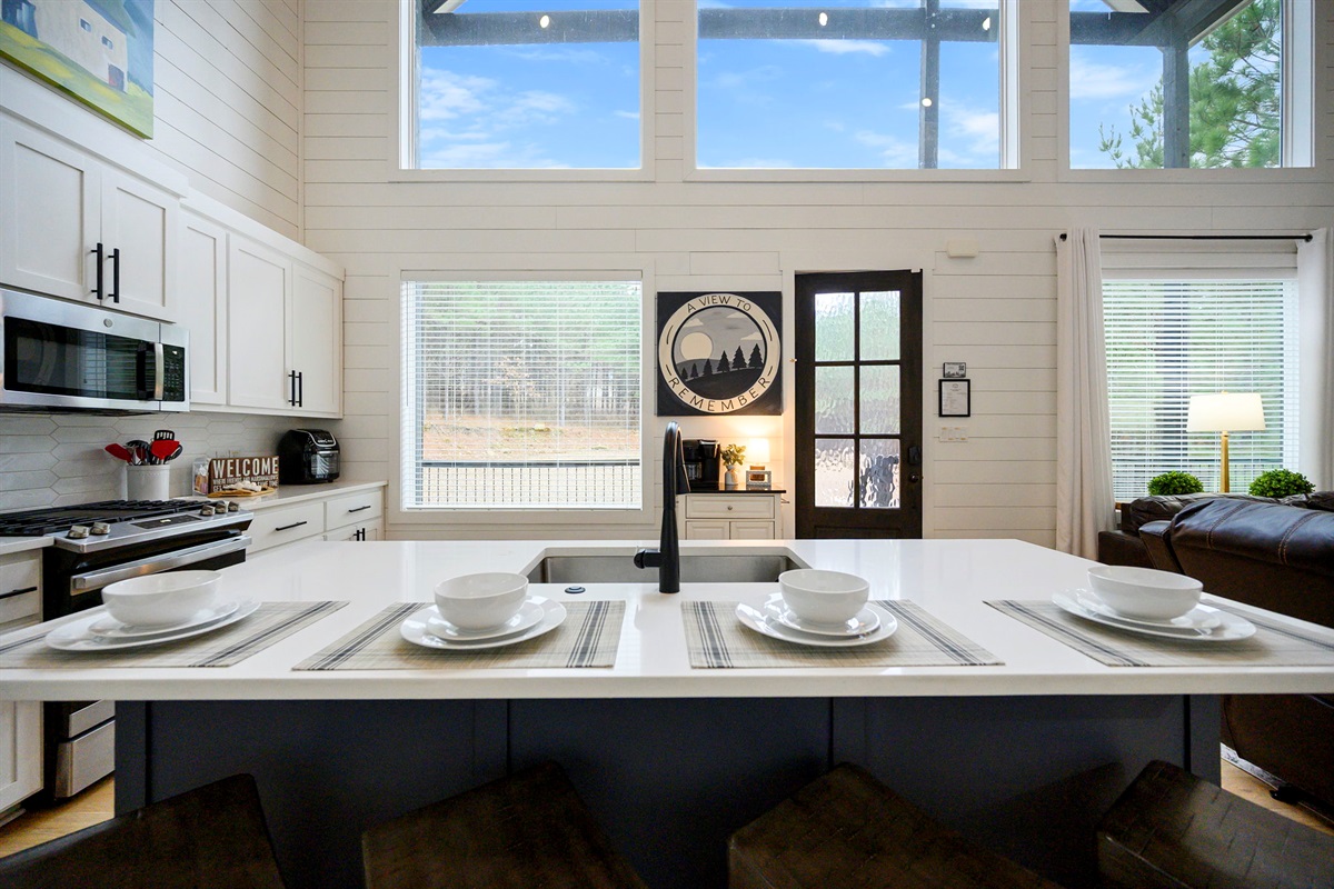 Bright, open kitchen overlooking the living space &mdash; modern comfort meets cabin style.
