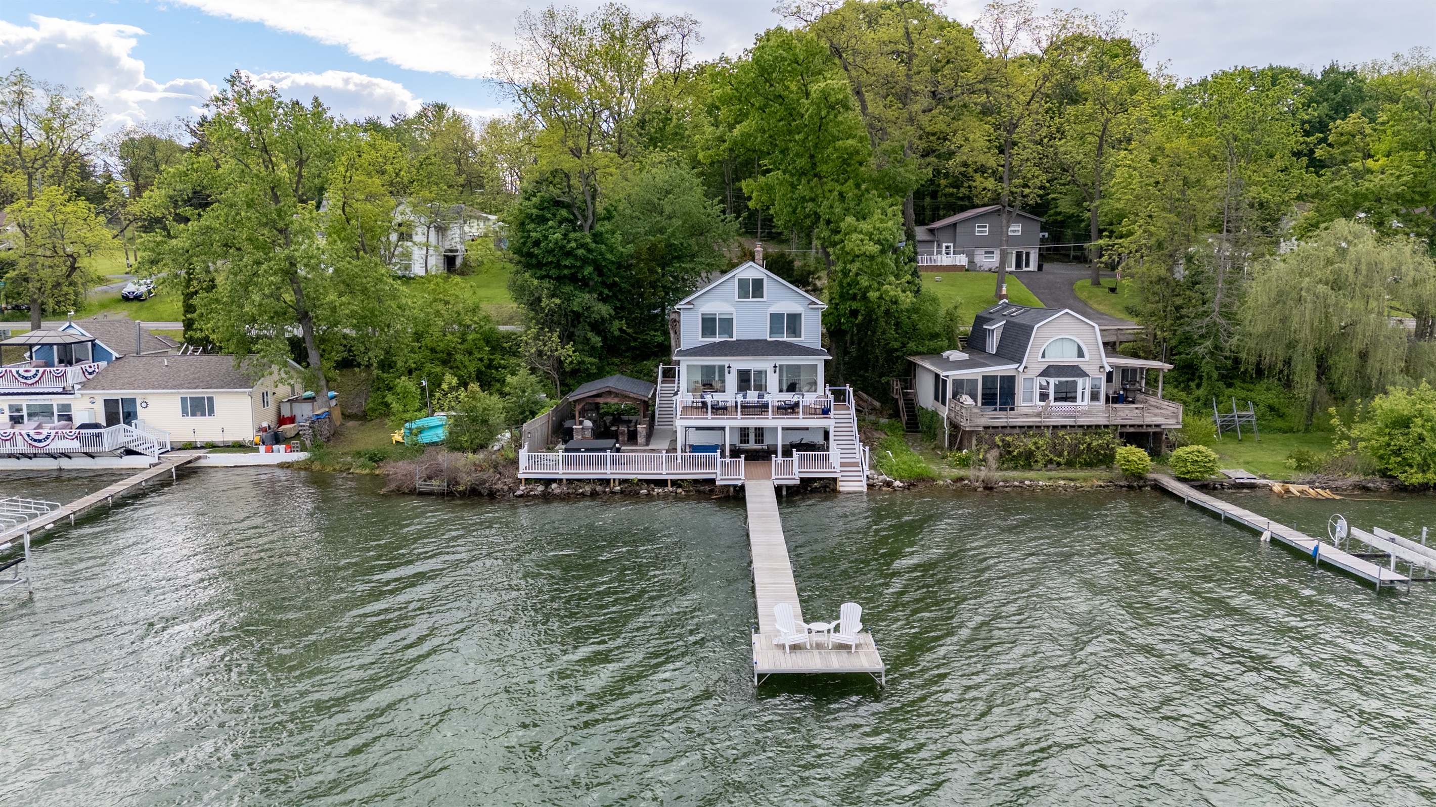 Stunning lakefront home with multi-level decks and a private dock—perfect for sunrise coffees and sunset cocktails 🌅🏡🚤