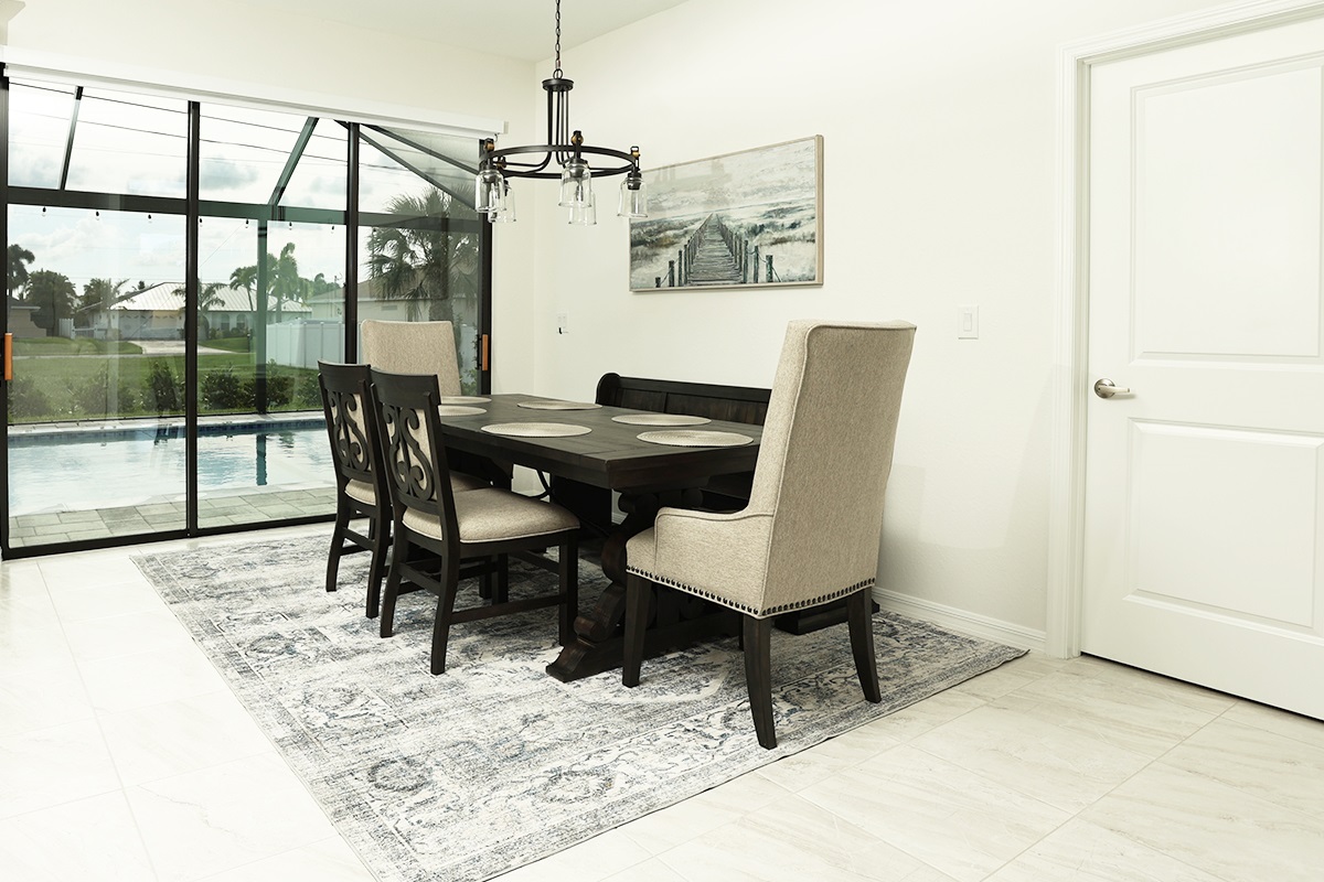 Dining table next to pool