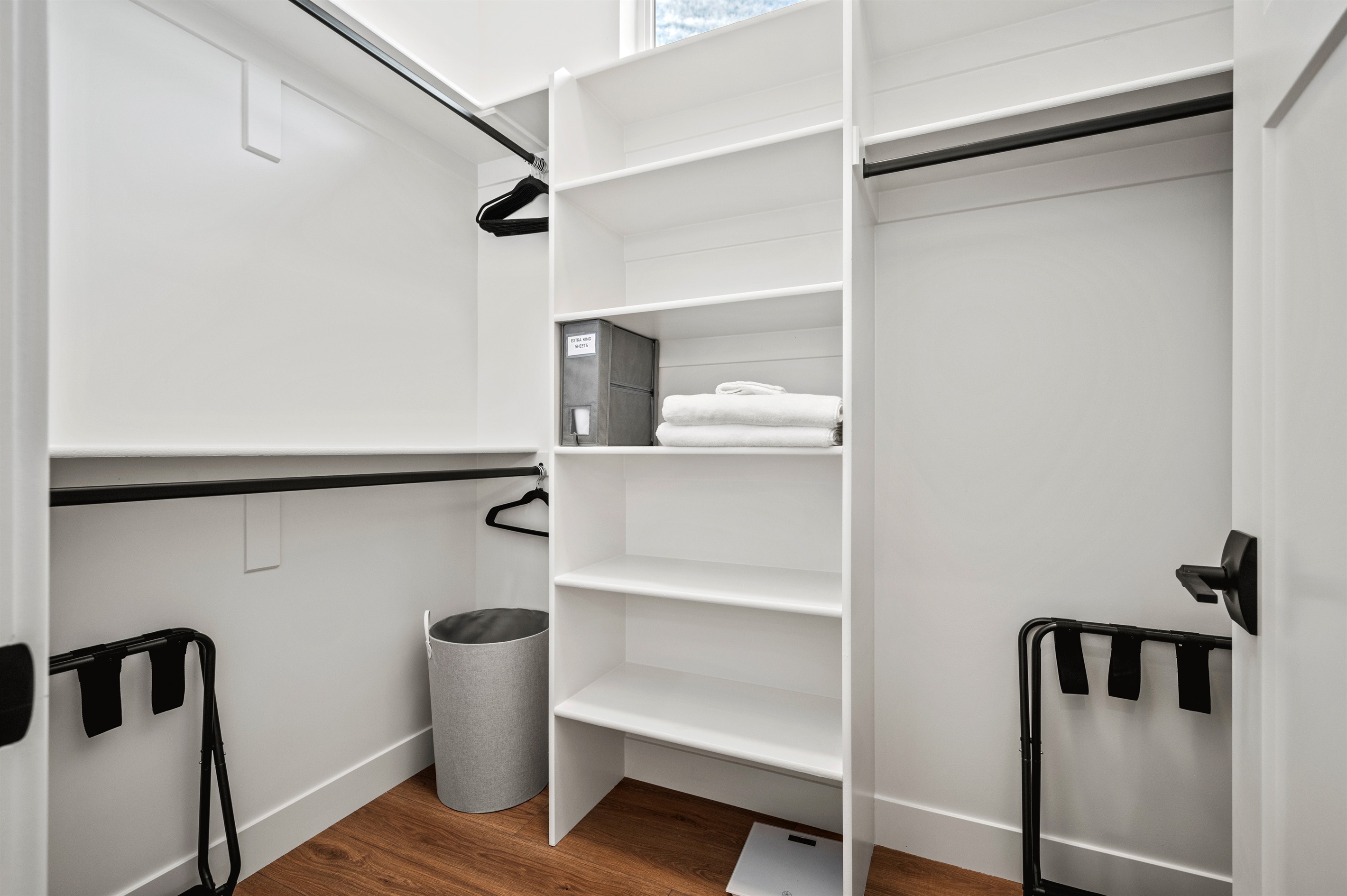 Spacious walk-in closet with ample room to neatly store all your clothing and travel essentials.