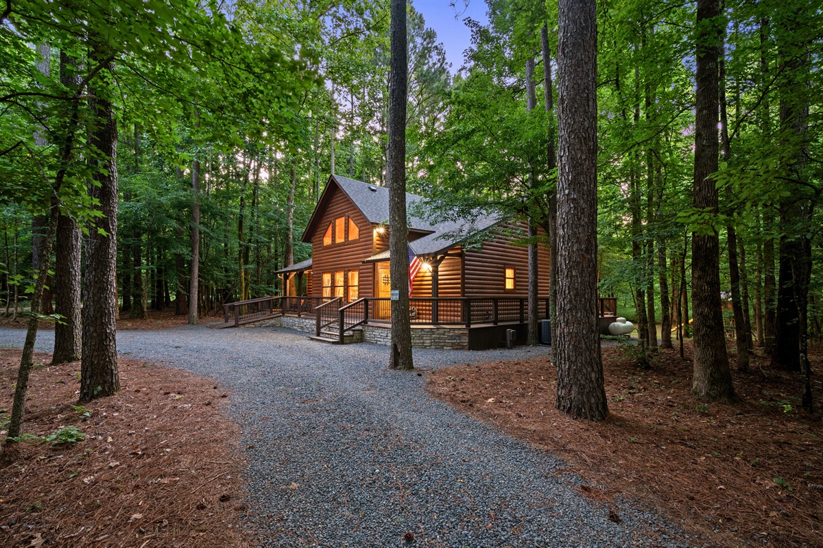 Private gravel driveway leads you through the woods to a peaceful and secluded cabin retreat.