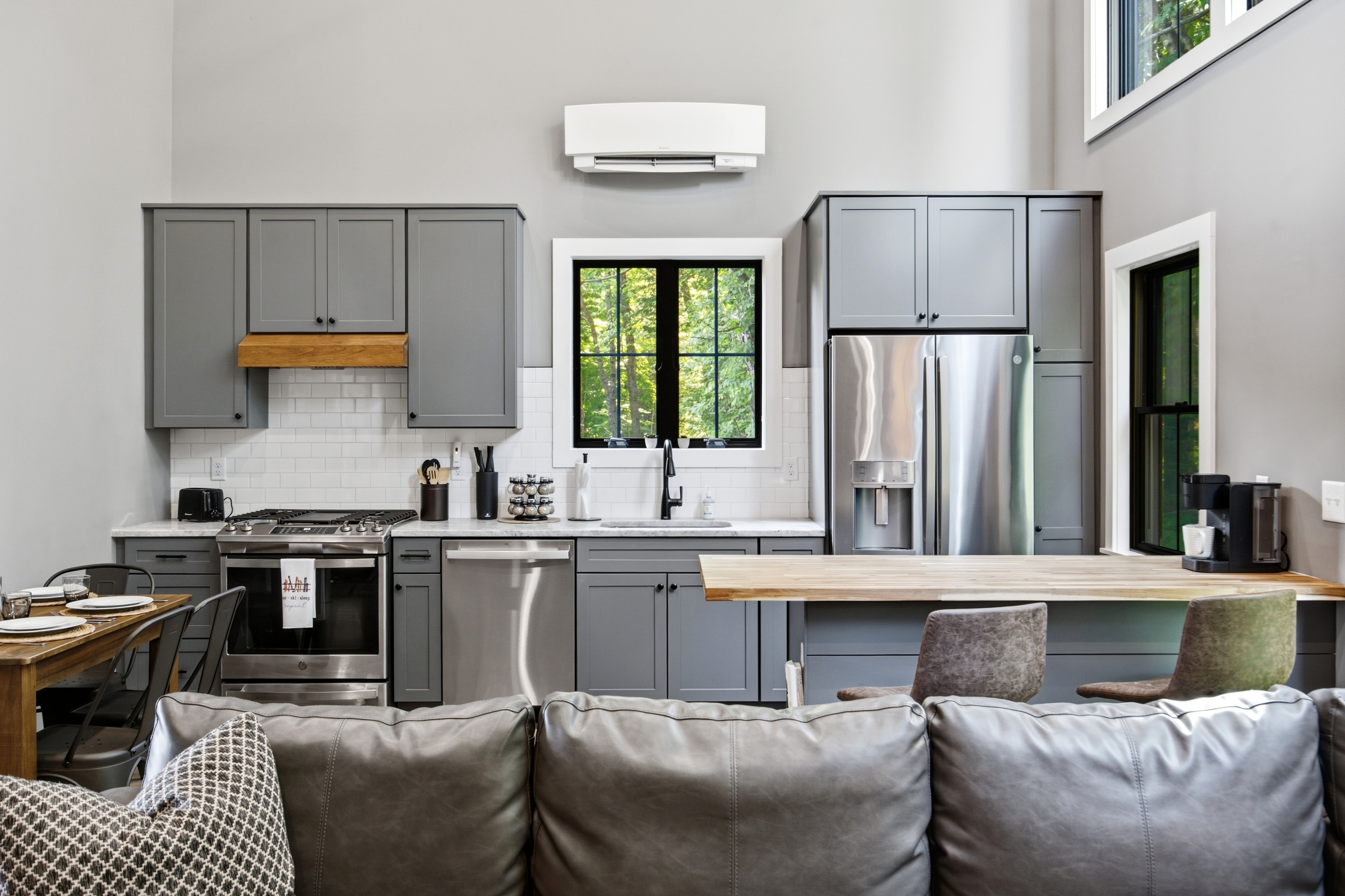 A seamless open layout keeps the kitchen and living spaces connected for easy group gatherings.