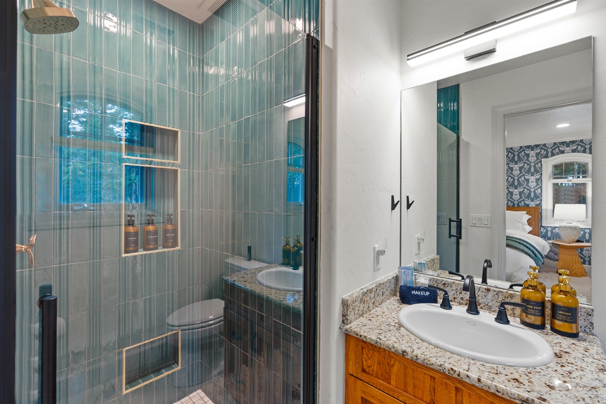 Ensuite bathroom - clean, crisp, and beautifully designed.