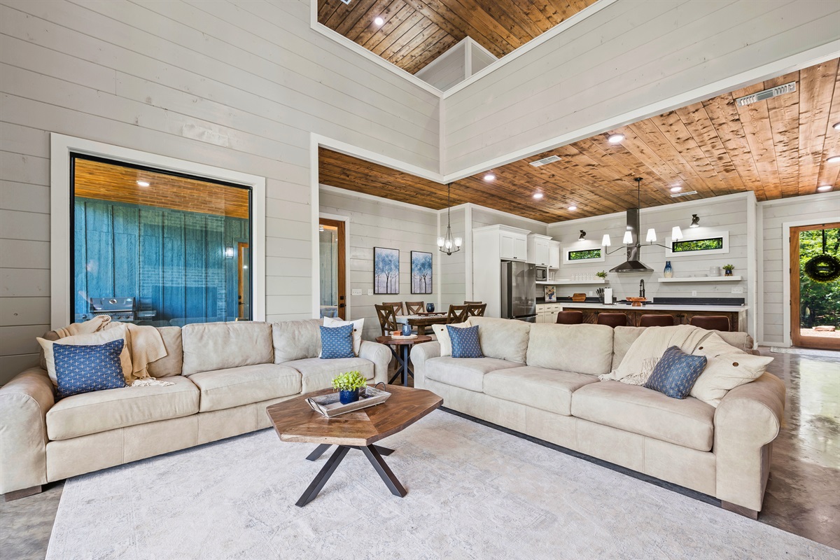 Spacious and inviting—our living room is designed for relaxation and togetherness, framed by views of the kitchen where memories are made.