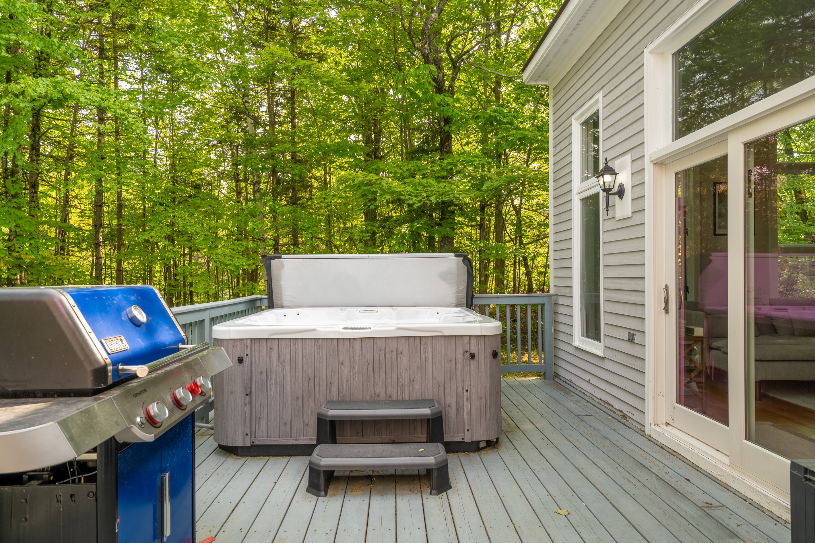 Private deck with hot tub and Weber gas grill for apres-ski relaxation at First Chair Lair