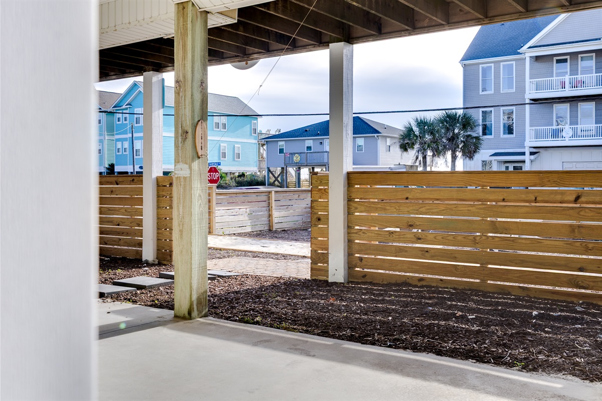 Step directly from the covered parking into the fully fenced yard, offering added privacy and convenience