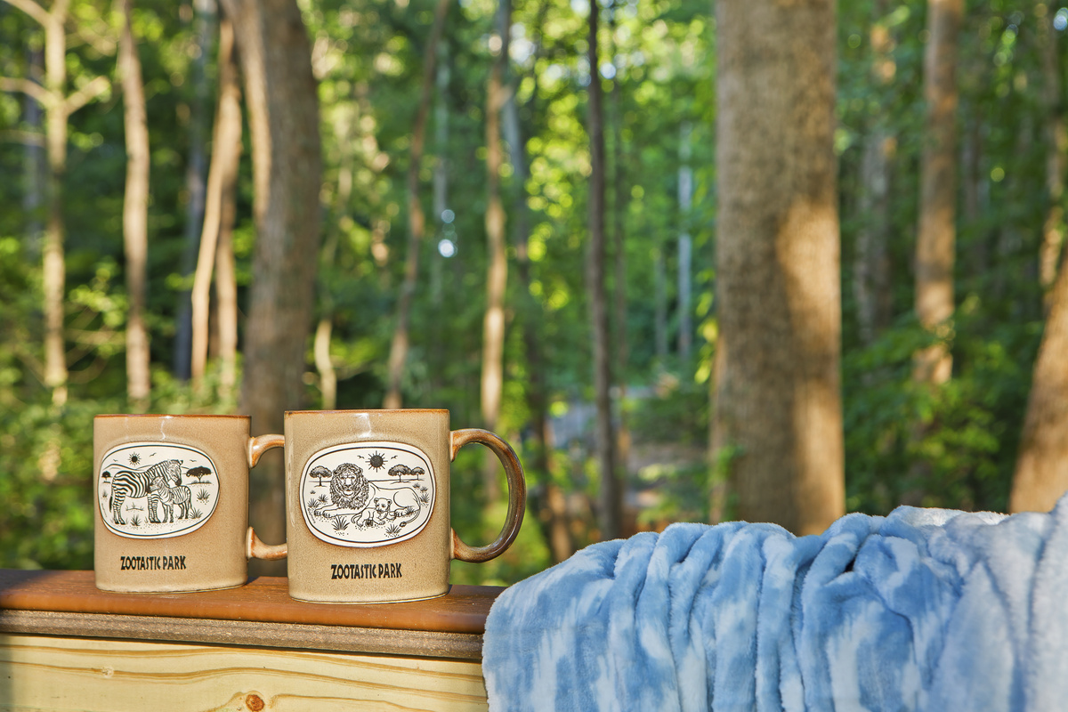 Brew & Relax: Sip coffee on the deck amid serene forest views and warm sunlight!