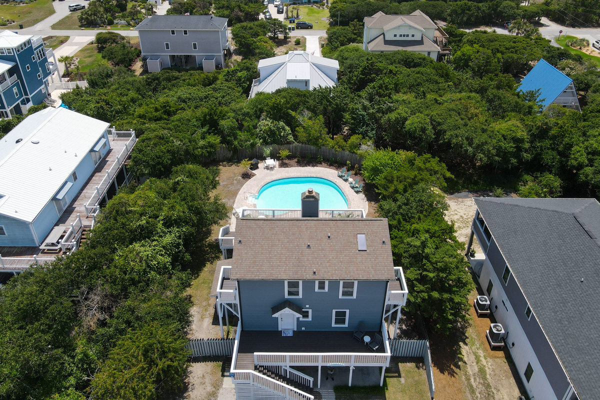 Aerial view showcasing SeaEsta&rsquo;s coastal location with the ocean just beyond the neighborhood