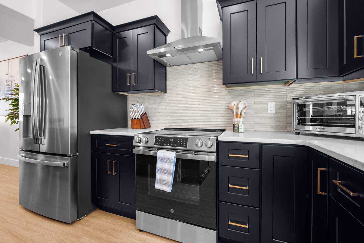 Sleek cabinetry, stainless appliances, and a clean contemporary design make this kitchen both stylish and functional.