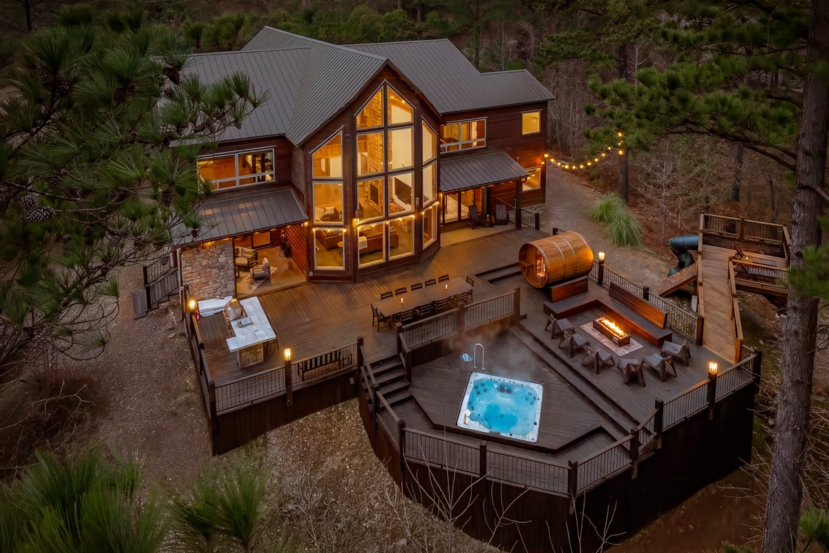 Hilltop views, glowing lights, and a sunken hot tub - your private outdoor retreat awaits!