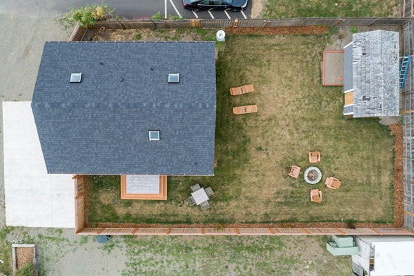 Slow M'ocean cottage has a large fenced backyard. 