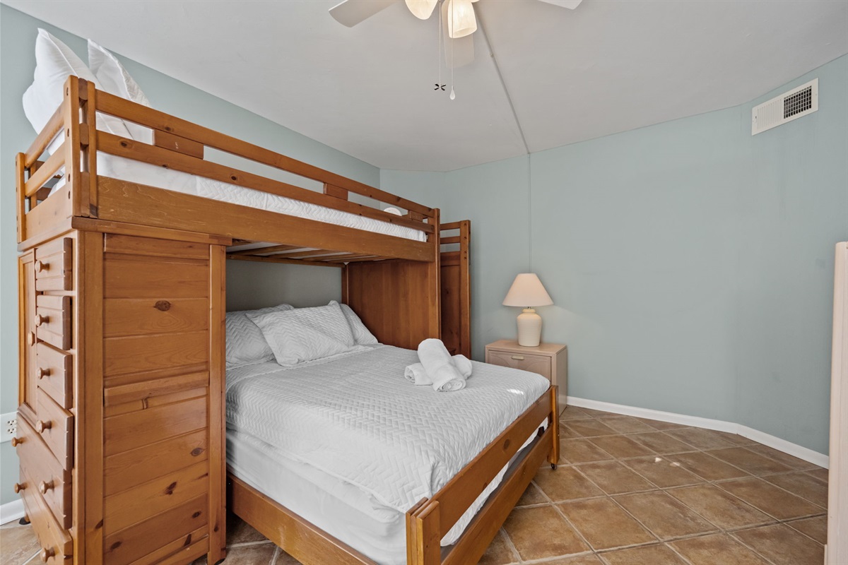 Spacious layout with bunk beds and additional floor space for luggage or play
