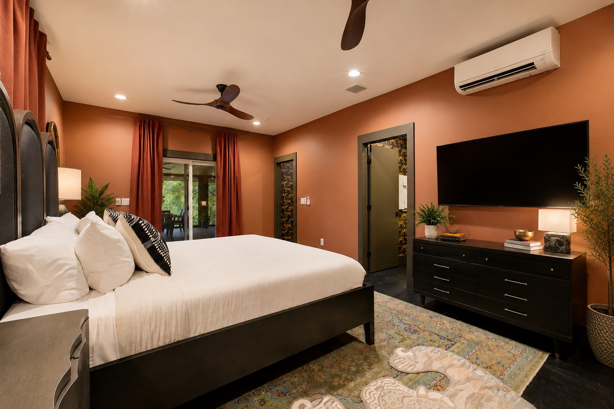 The primary bedroom below the main level includes a king bed, ensuite full bath and access to the screened in porch with ping pong table!