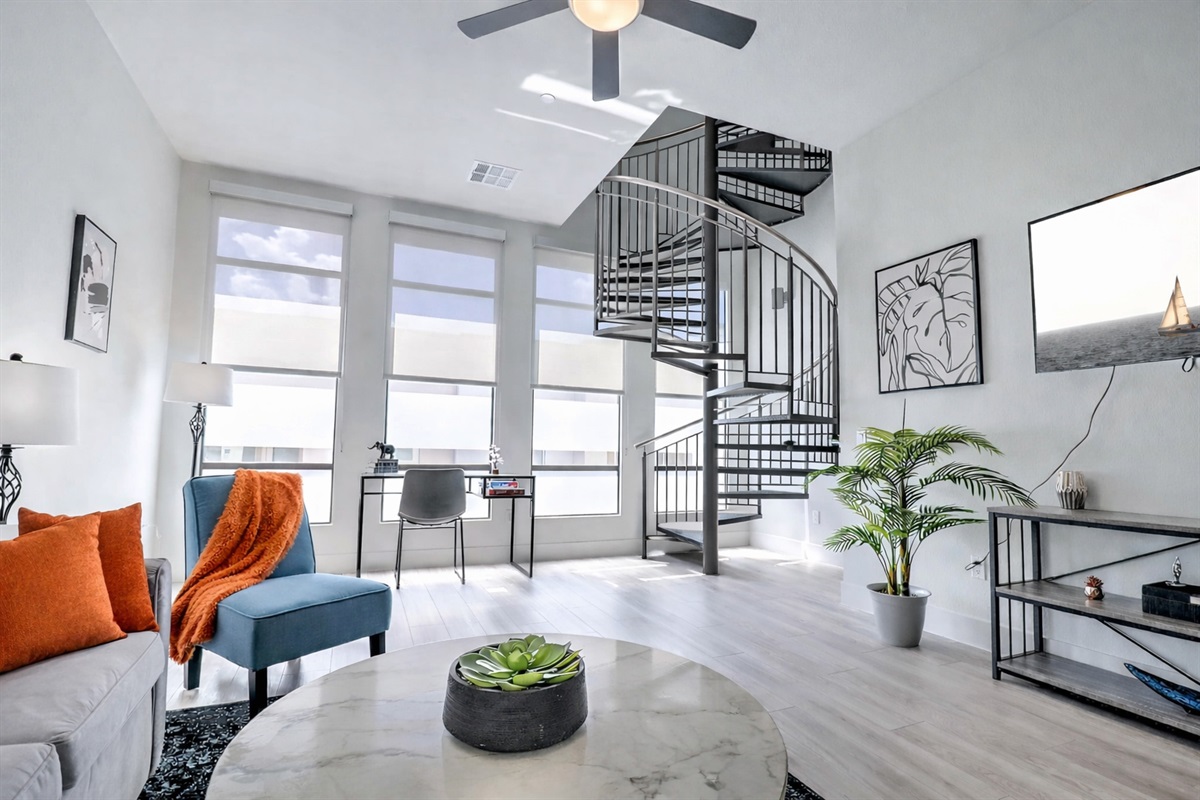 Comfortable seating area with a clean, modern design and a relaxing atmosphere. Perfect for unwinding, reading, or enjoying your time indoors during your stay.