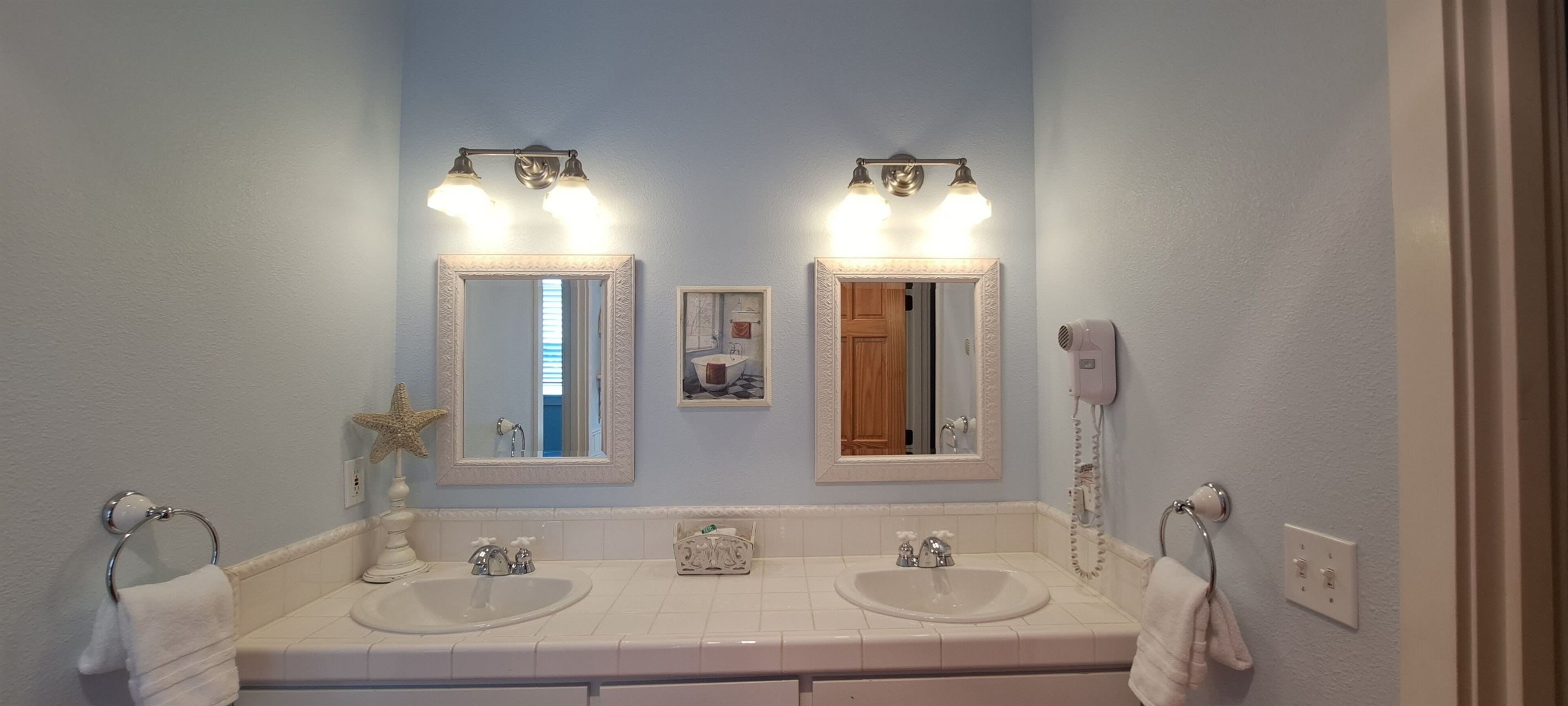 Dual his-and-hers sinks make getting beach-ready a breeze.