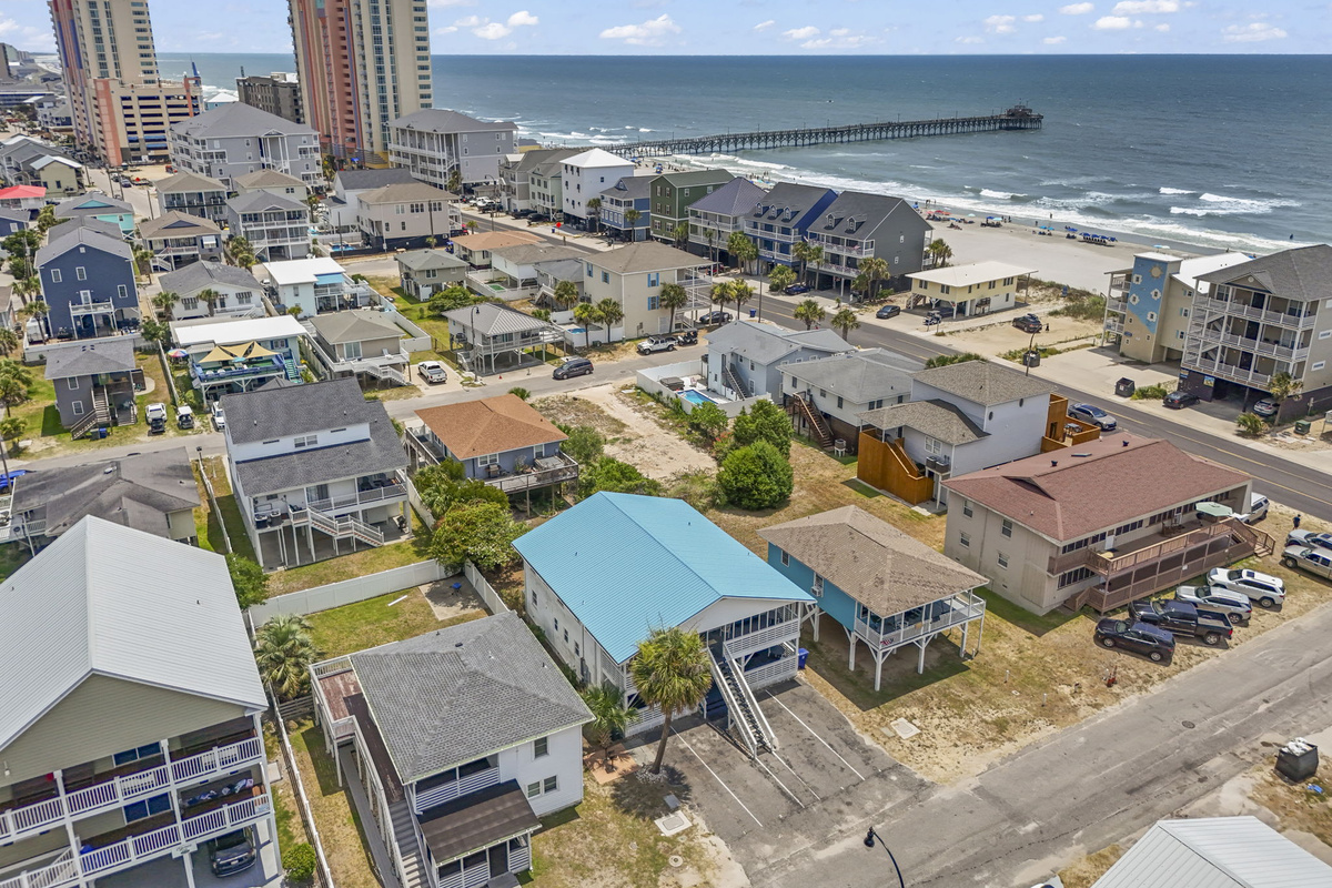 The bottom floor of this 4Plex that includes two units that are each 2 bedroom 1 bath giving you 4 full bedrooms and 3 bathrooms.  Walking distance to Cherry Grove Fishing Pier, Resturaunts and more!