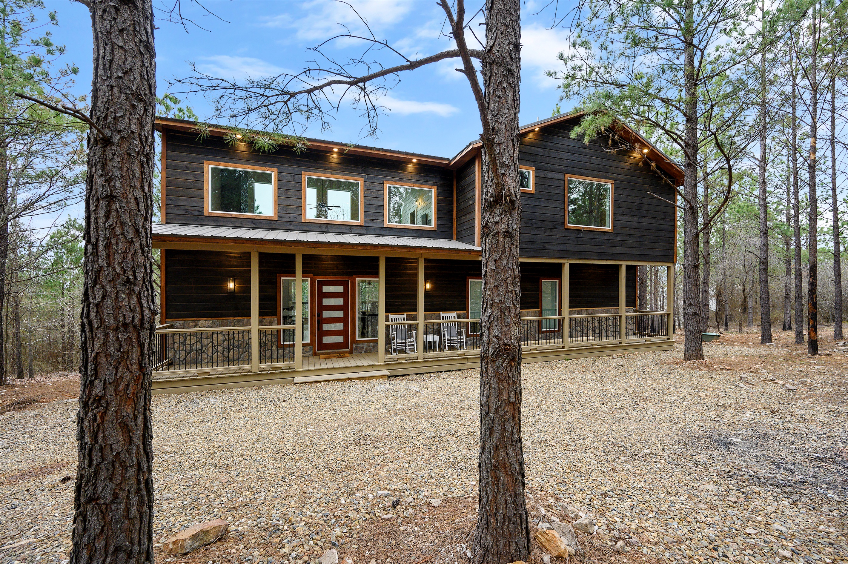 A clean, inviting cabin entrance featuring the front door — a simple and welcoming first impression of your private getaway.