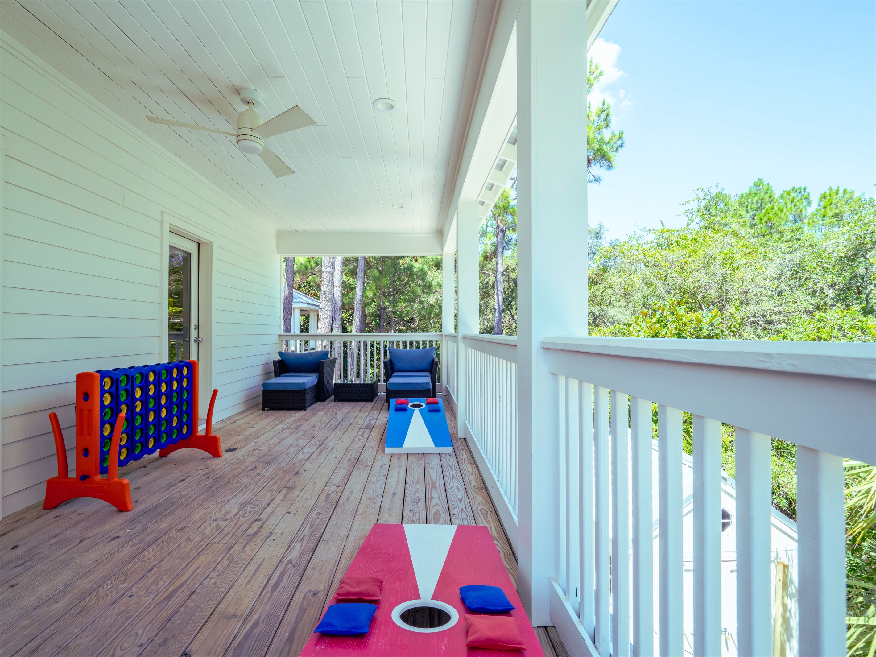 Spacious deck with seating areas, cornhole, and ring toss - perfect for outdoor fun and relaxing evenings