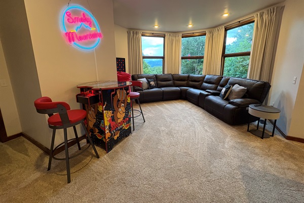 Game Room has Arcade Machine, Oversized Bean Bag, Large Connect Four & Smart Sound Speaker Table