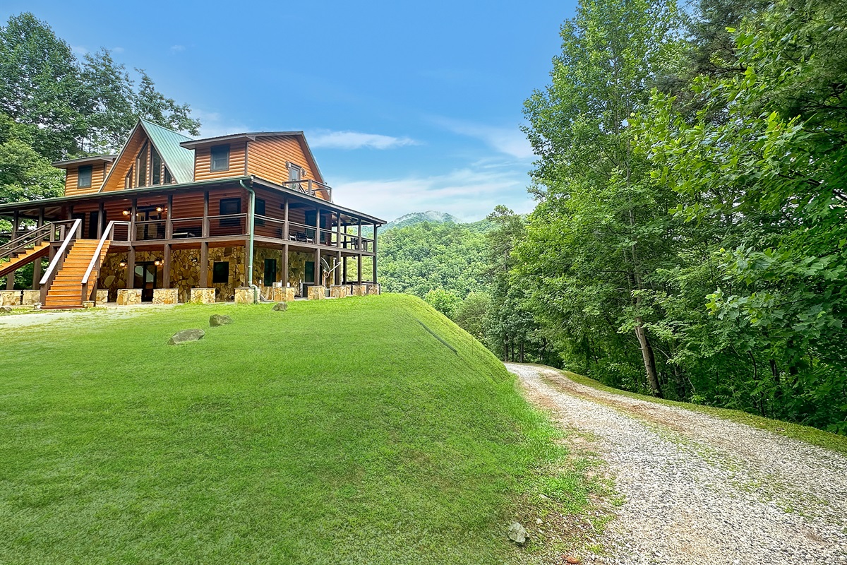 Exterior: Stunning mountain views and spacious wrap-around porch await your adventure!
